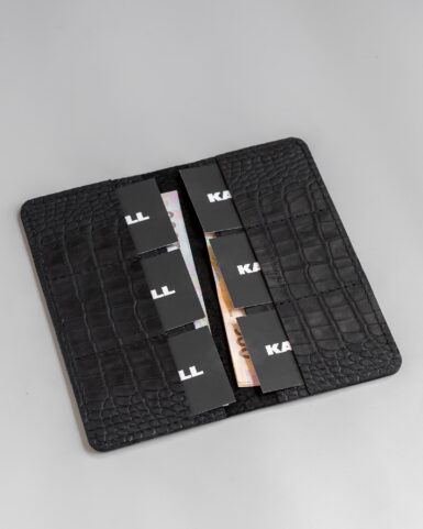 price for Clutch made of calfskin embossed with crocodile in black color
