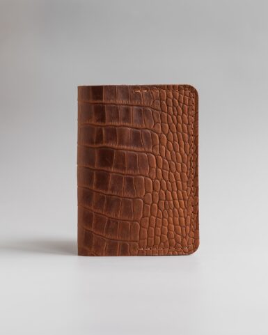 price for Cover for a passport made of calf leather embossed with a crocodile pattern in red color