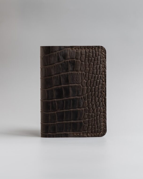 Passport cover in dark brown calfskin embossed crocodile