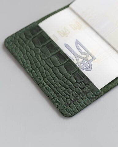 Cover for a passport made of calfskin embossed with a crocodile in dark green color in Kyiv