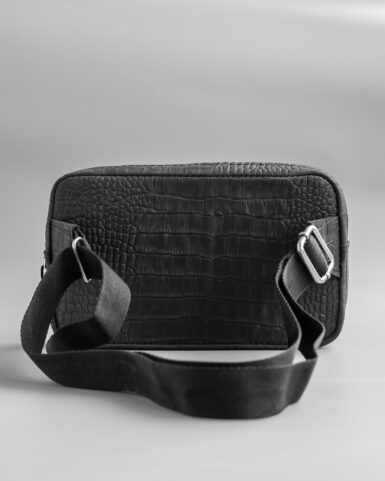 Leather belt bag (banana) in black, crocodile embossed