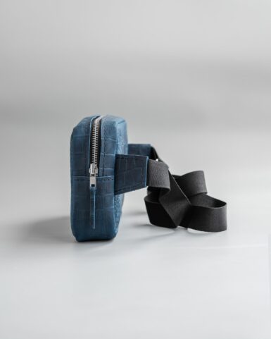 price for Leather belt bag (banana) in dark blue color, embossed with a crocodile