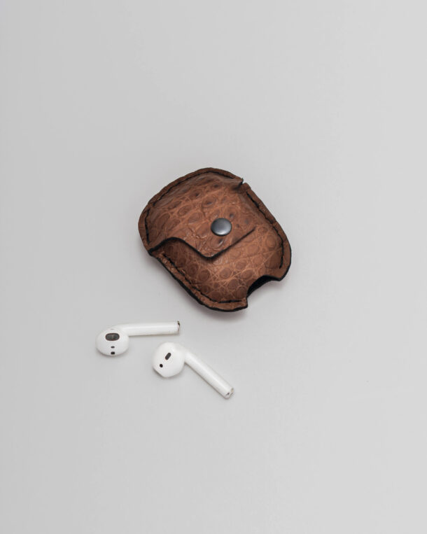 Case for AirPods from brown skin of a crocodile