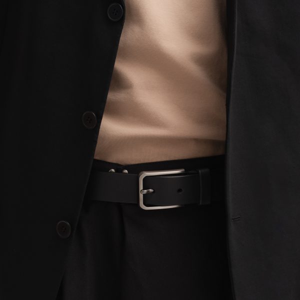 Black leather belt with a gray buckle