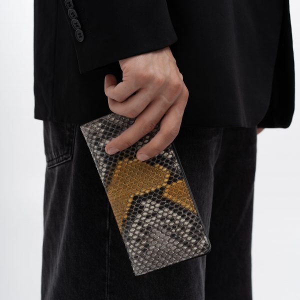 A wallet made of gray-yellow python skin with small scales